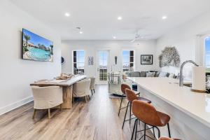 a kitchen and living room with a table and chairs at Spanish Dagger Serenity in Port Aransas