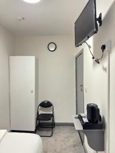 TV a/nebo společenská místnost v ubytování Ivy House Hotel + 21 fotografií