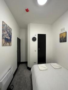 Postel nebo postele na pokoji v ubytování Ivy House Hotel