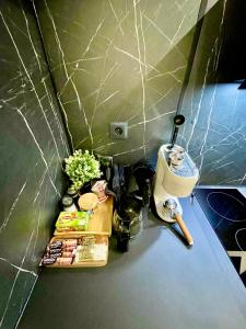 a kitchen counter with a table with food on it at Modern Home Loft in Alexandroupoli +14 photos