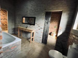 Ett badrum på Syeta Bush Lodge