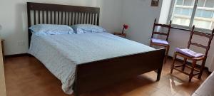 A bed or beds in a room at La G