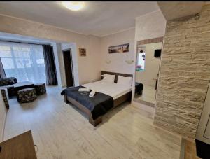 A bed or beds in a room at Guest House Simon Green