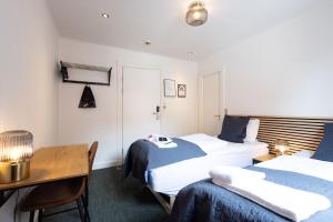 Milling Hotel Mini 19客房内的一张或多张床位