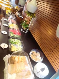 a buffet line of food on a table at Hotel Martina in Żnin
