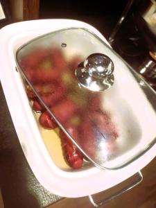 a spoon is sitting in a sink with food at Hotel Martina in Żnin