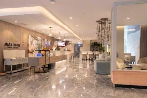 Area lobi atau resepsionis di MASA Hotel & Spa Campo Grande Collection
