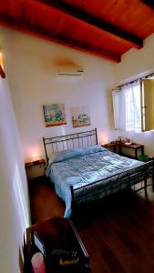 Un pat sau paturi într-o cameră la Polani - Il Noceto