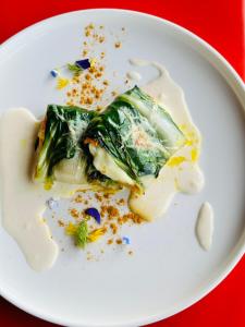 a white plate with a piece of food on it at Bioagriturismo il cerreto in Pomarance