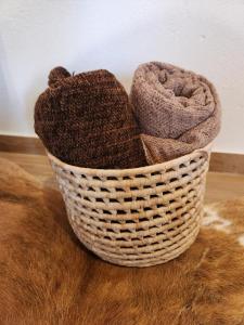 a basket filled with yarn sitting on top of a table at POUSADA SERTÃO DA BOCAINA in Cunha