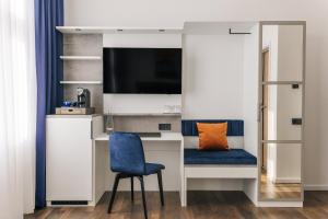TV a/nebo společenská místnost v ubytování Homaris East Side