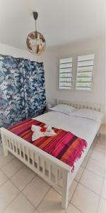 Ліжко або ліжка в номері Les Koki villa Gwada Blue