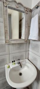 Ένα μπάνιο στο Suítes da Praça Tiradentes