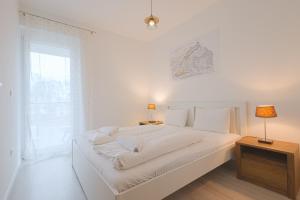 Posteľ alebo postele v izbe v ubytovaní Casa Mimoza Apartman By BLTN Balatonföldvár