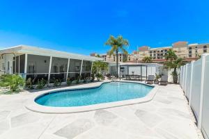 a swimming pool in front of a building at Coconut Walk To The BeachComfy Beds Firepit Pool in Fort Lauderdale