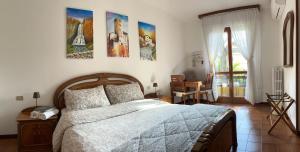A bed or beds in a room at Villa Dei Cedri