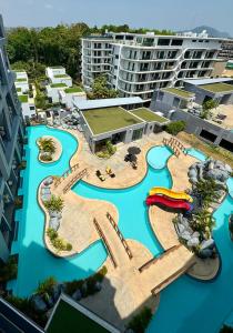 an aerial view of a resort with a water park at Utopia - the best condo project at Naiharn in Rawai Beach