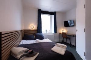 Milling Hotel Mini 19客房内的一张或多张床位