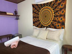 Cama ou camas em um quarto em Pousada do Tom
