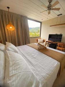 Cama ou camas em um quarto em Pousada Yamandu - Piscinas Aquecidas