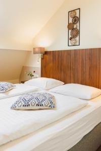 Łóżko lub łóżka w pokoju w obiekcie Hotel Kaiserhof