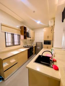 a kitchen with a sink and a counter top at Service apartment is Abuja in Abuja