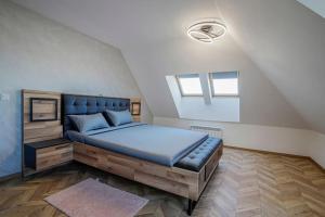 a bedroom with a large bed in a attic at 20% Discount! 2 Bedroom Apartment Vitosha View in Sofia