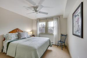 a bedroom with a bed and a ceiling fan at Home with Fire Pit, 10min to Attitash Mtn Resort in Jackson