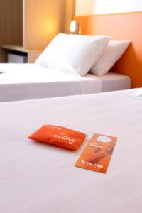 Postel nebo postele na pokoji v ubytování HUS Hotel MARINGA