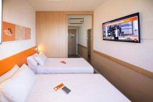 Postel nebo postele na pokoji v ubytování HUS Hotel MARINGA