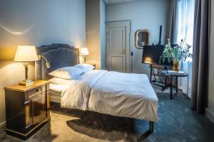 Voodi või voodid majutusasutuse Hotel Royal toas