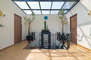 a conservatory with a skylight in a house at Pug Seal Polanco Allan Poe in Mexico City