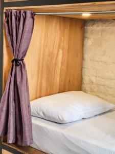 Postel nebo postele na pokoji v ubytování MedioMundo Hostel