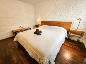 Postel nebo postele na pokoji v ubytování MedioMundo Hostel
