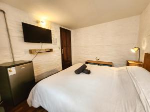 Postel nebo postele na pokoji v ubytování MedioMundo Hostel