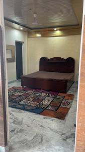 a bedroom with a large bed in a room at Occasions in Jammu