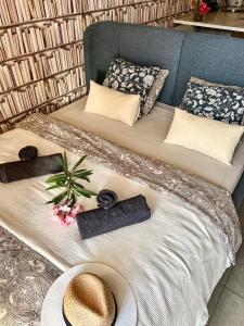 a bed with hats and pillows on it at Tenerife Paradise Anna Studio in Adeje