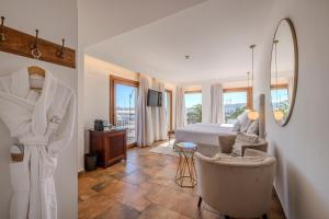 a hotel room with a bed and a mirror at La Posada del Mar in Denia +75 photos