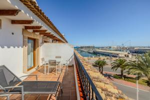 a balcony of a house with a view of the ocean at La Posada del Mar in Denia