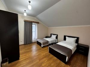 Ein Bett oder Betten in einem Zimmer der Unterkunft Zartonq