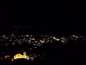 a view of a city at night with lights at Casa delle Campane in Scala