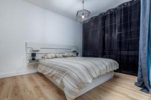 En eller flere senge i et værelse på Oasis Urbaine for 8 near to Paris