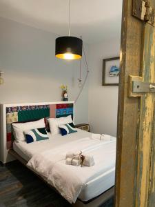 a bedroom with a bed with a dog on it at S'accabbadora Guest House in Alghero