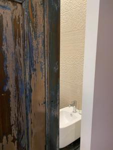 a bathroom with a sink and a sink at S'accabbadora Guest House in Alghero