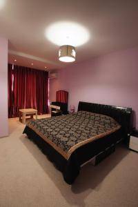 Кровать или кровати в номере Mini hotel in Observatorniy