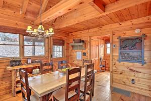 a dining room with a wooden table and chairs at Pet-Friendly Mountain Retreat Fire Pit Hot Tub in Blue Ridge
