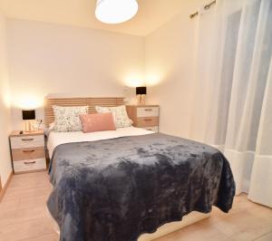 a bedroom with a large bed with two night stands at El balcón de la inspiración en plena natura HUT-8434 in Encamp