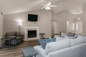 a living room with a couch and a fireplace at Happy Ours in Foley