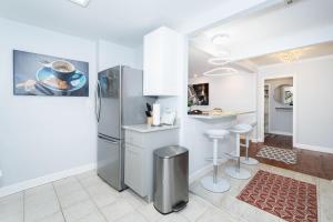 a kitchen with a stainless steel refrigerator and a counter at 21Floor-Renovated 2BR,1Bath King and Queen Bed and Parking in Atlanta
