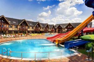 a resort with a slide and a water park at apartmán Sienna in Bešeňová